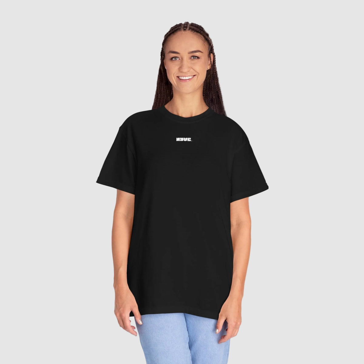 Person wearing a black t-shirt with a tree graphic and text on a white background