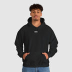 Person wearing a black hoodie on a white background